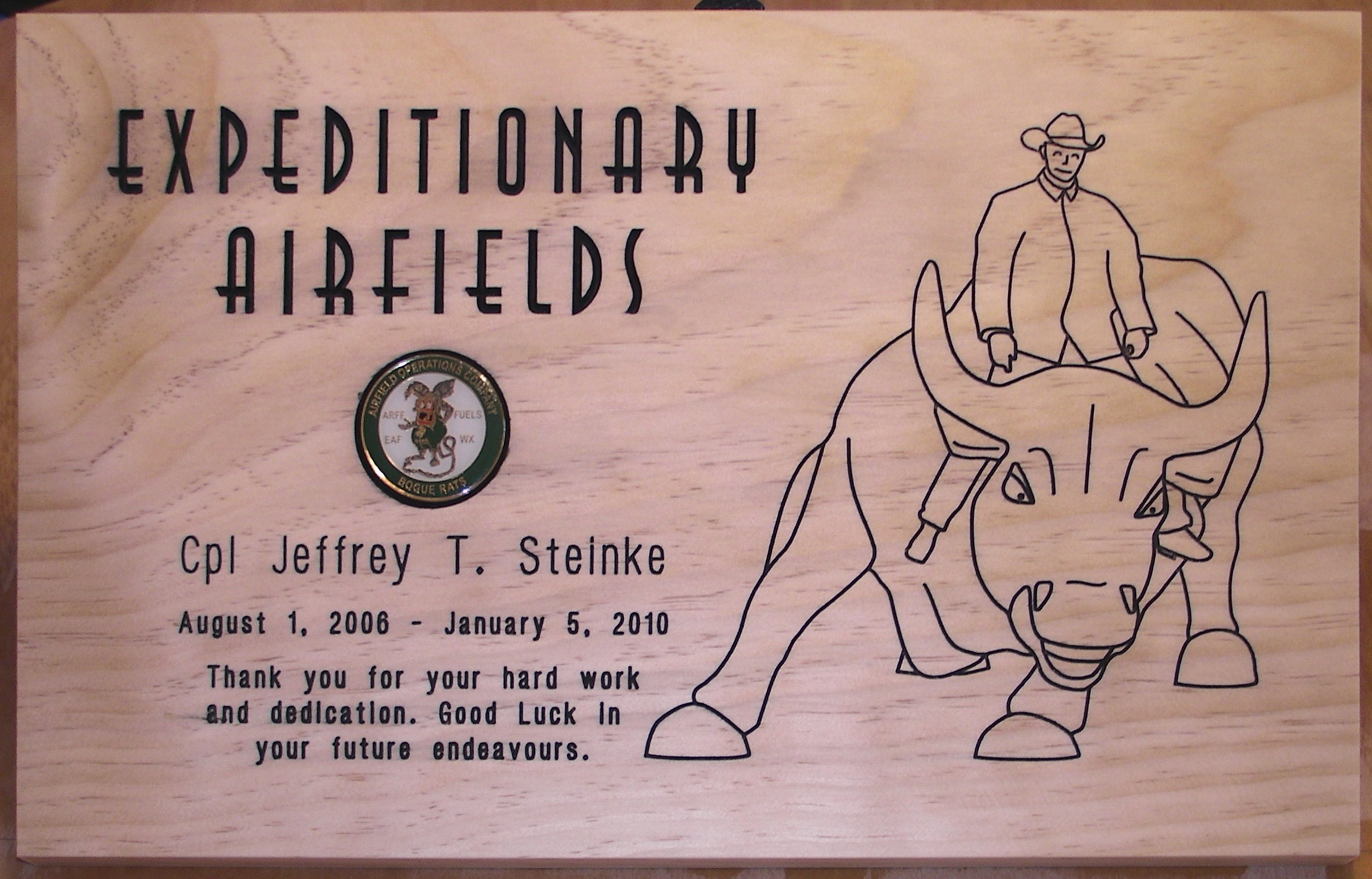 Another plaque with lineart from a picture of the Marine riding the Merrill Lynch Bull in New York City. 